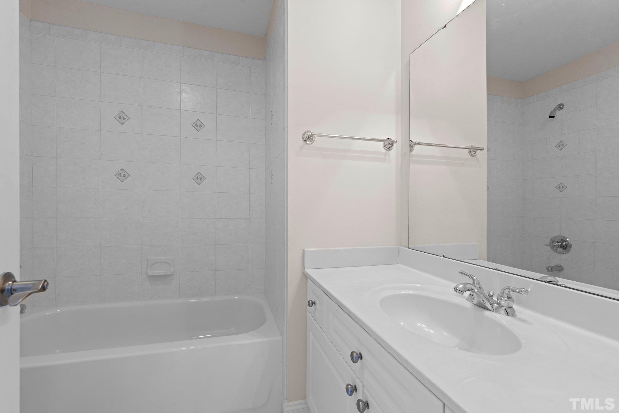 4800 Patton Ridge Court Raleigh, NC 27612 - Photo 55 of 61 a bathroom with a sink and a bathtub