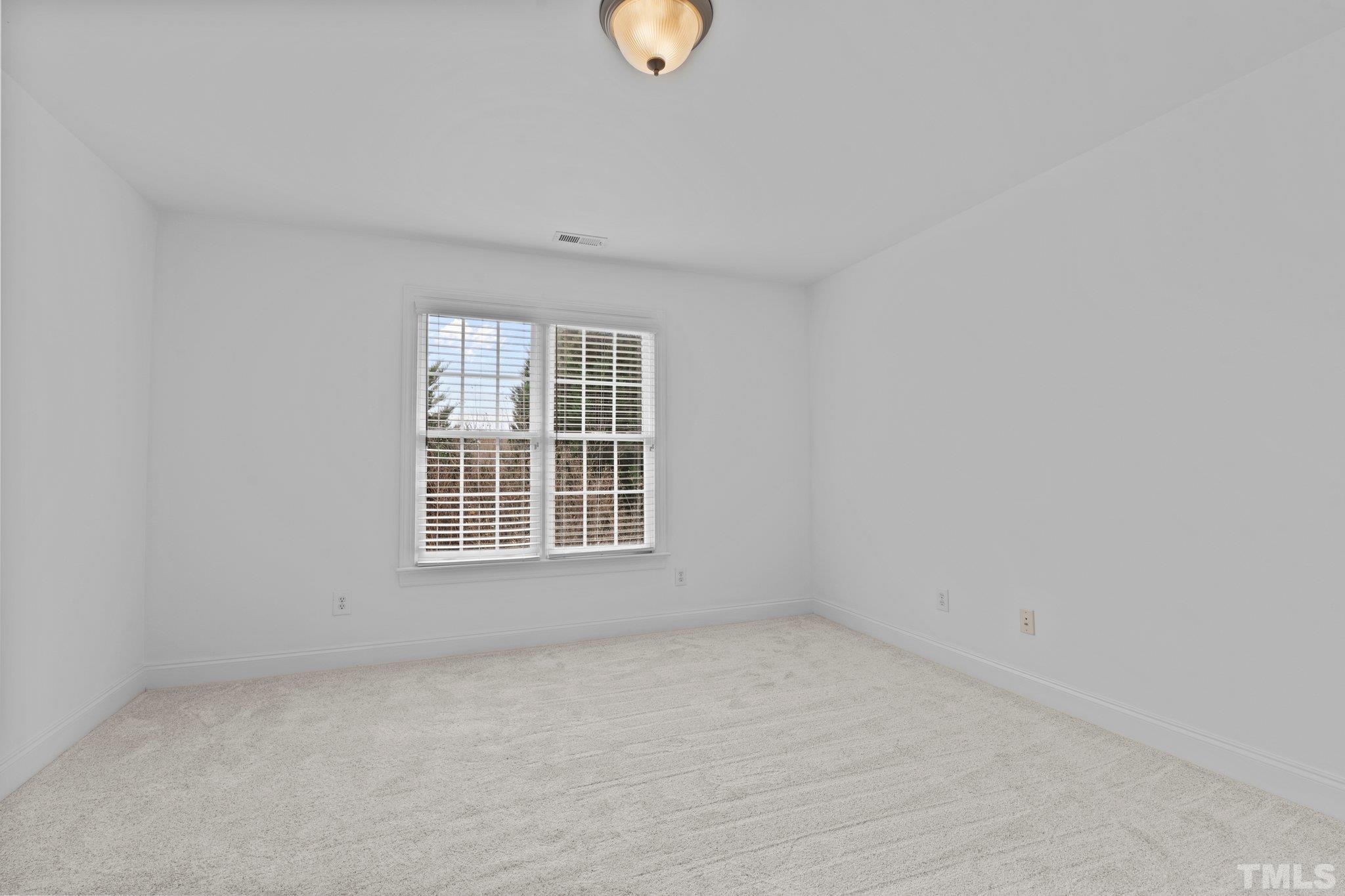 4800 Patton Ridge Court Raleigh, NC 27612 - Photo 58 of 61 an empty room with a window