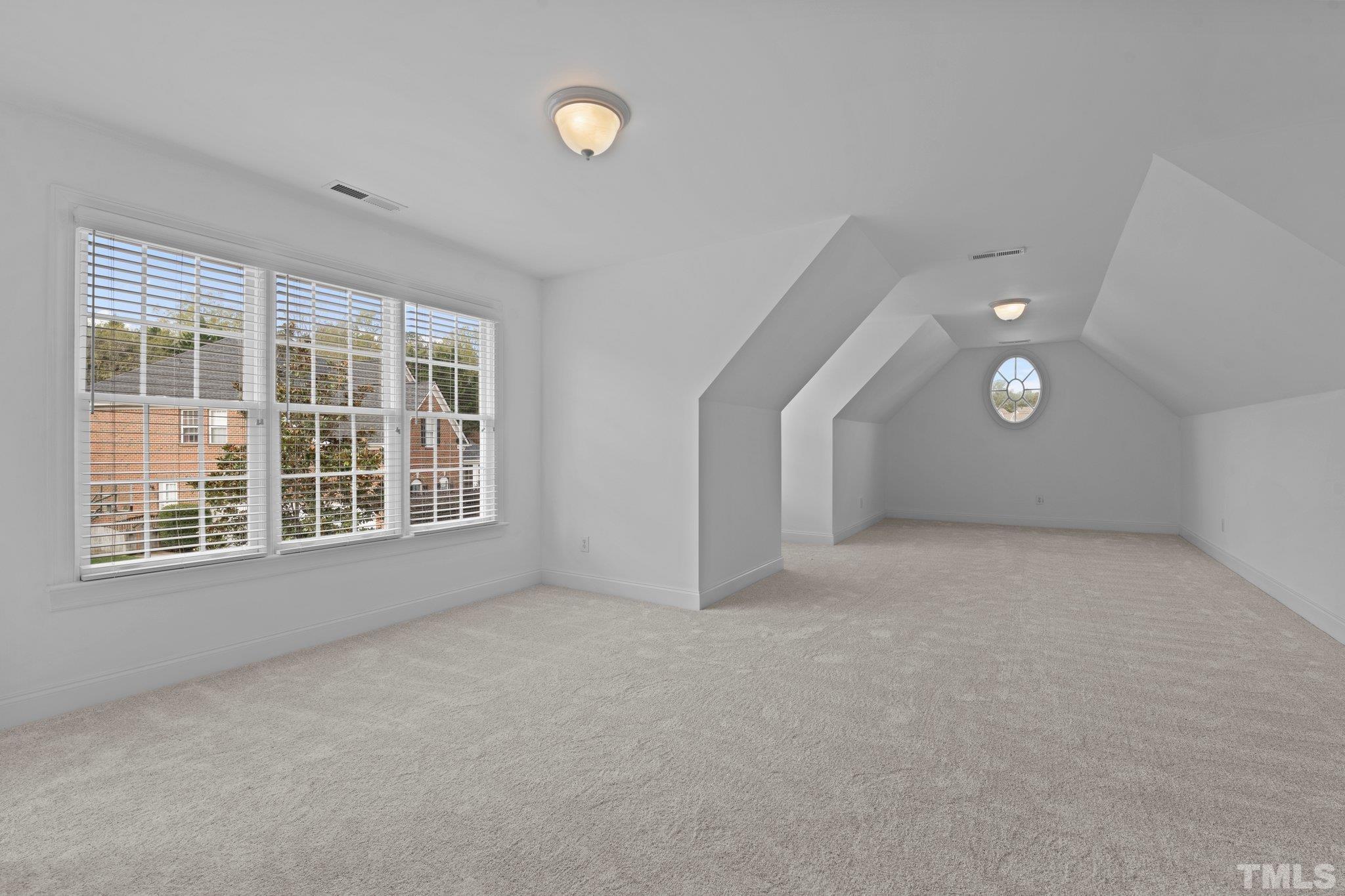 4800 Patton Ridge Court Raleigh, NC 27612 - Photo 60 of 61 an empty room with windows and entrance