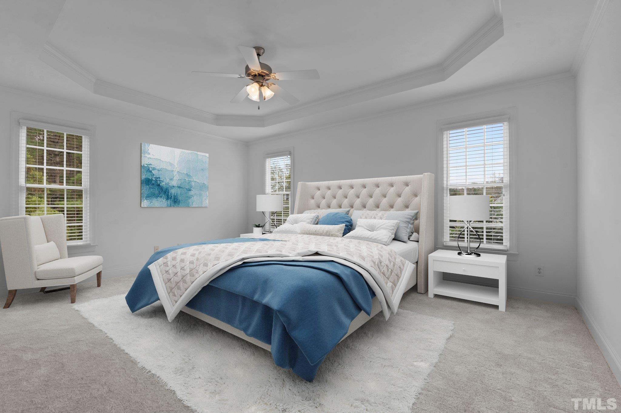 4800 Patton Ridge Court Raleigh, NC 27612 - Photo 6 of 61 a spacious bedroom with a bed and a chandelier