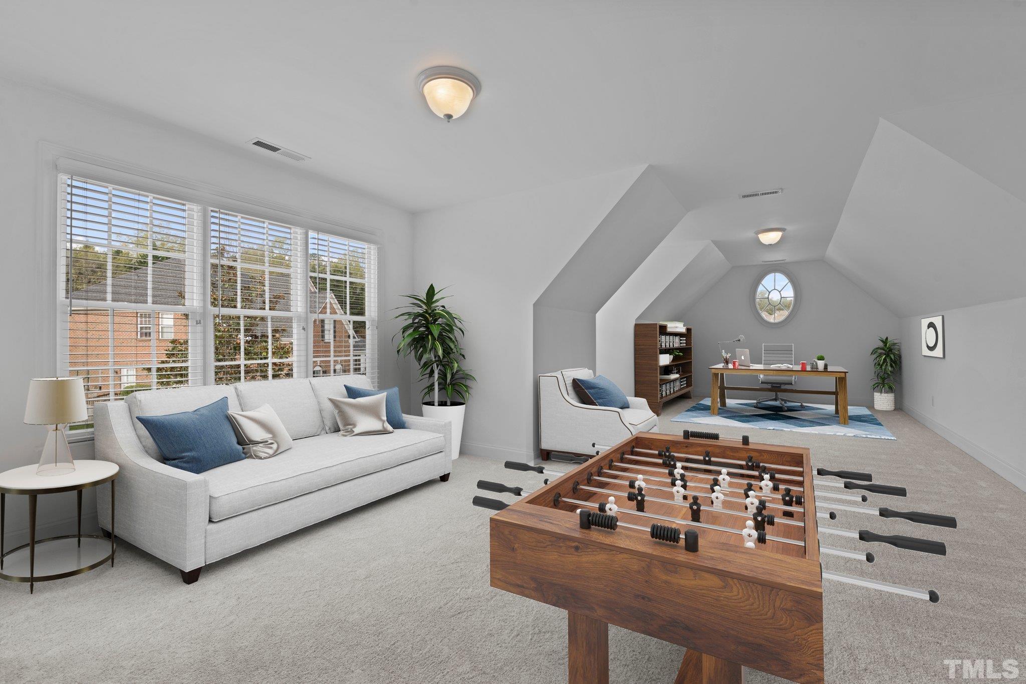 4800 Patton Ridge Court Raleigh, NC 27612 - Photo 8 of 61 a living room with furniture and a flat screen tv