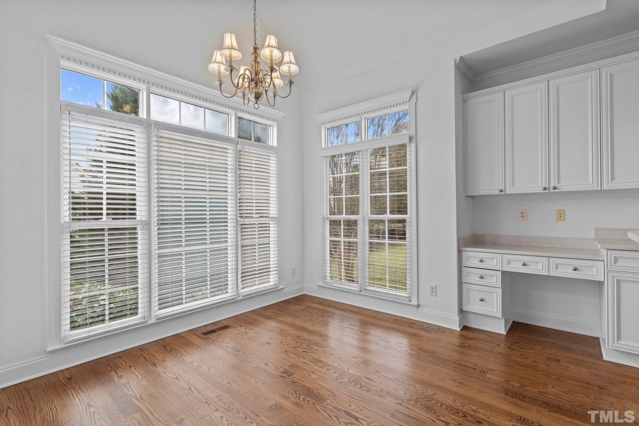 4800 Patton Ridge Court Raleigh, NC 27612 - Photo 10 of 61 a view of an empty room with a kitchen and a window