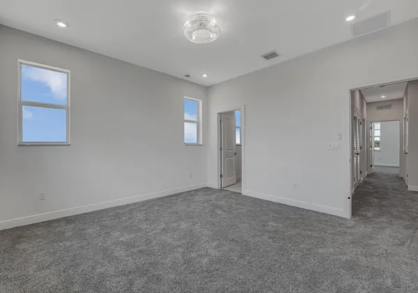 a view of an empty room and a window