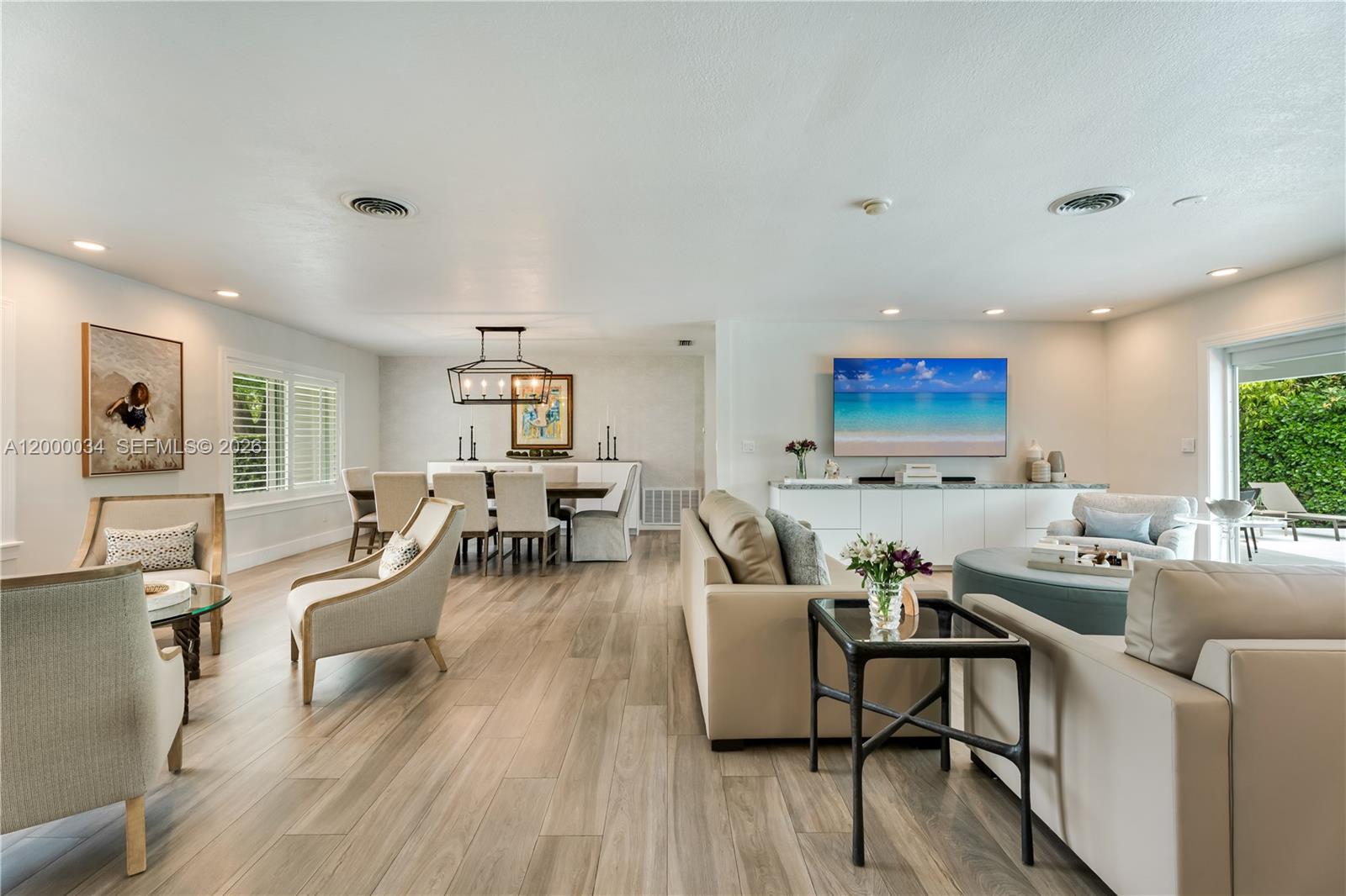 9511 Southwest 93rd Street Miami, FL 33176 - Photo 12 of 56 a living room with furniture and a wooden floor