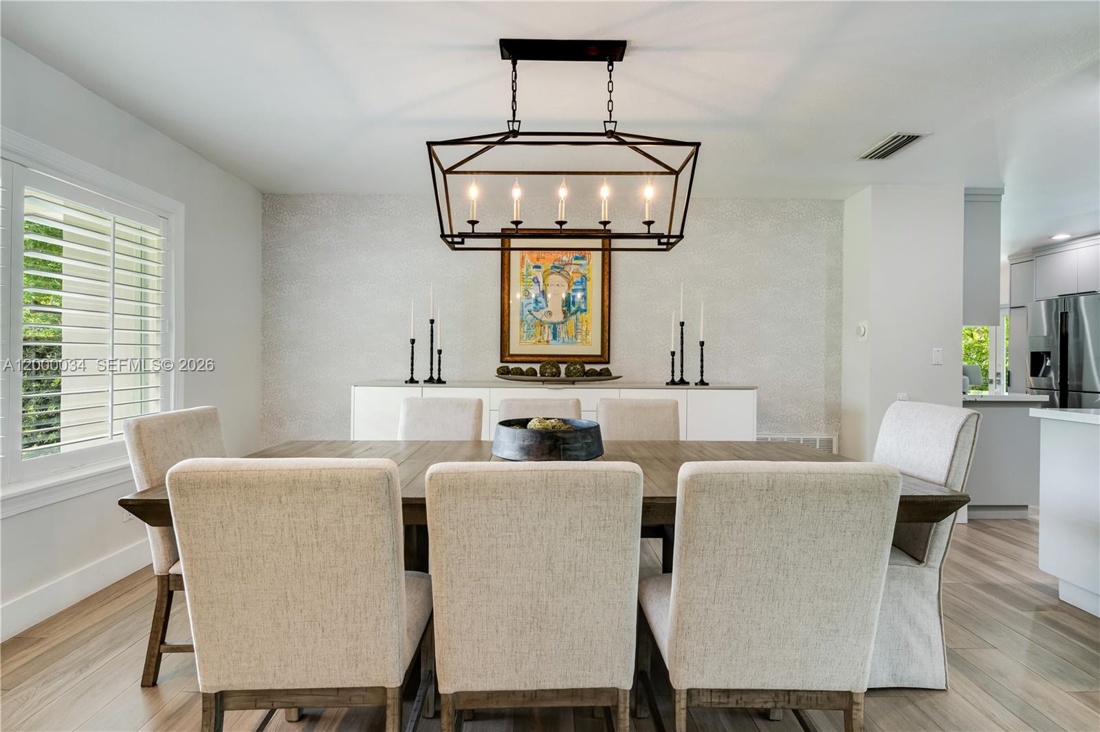 9511 Southwest 93rd Street Miami, FL 33176 - Photo 15 of 56 a view of a dining room with furniture window and wooden floor