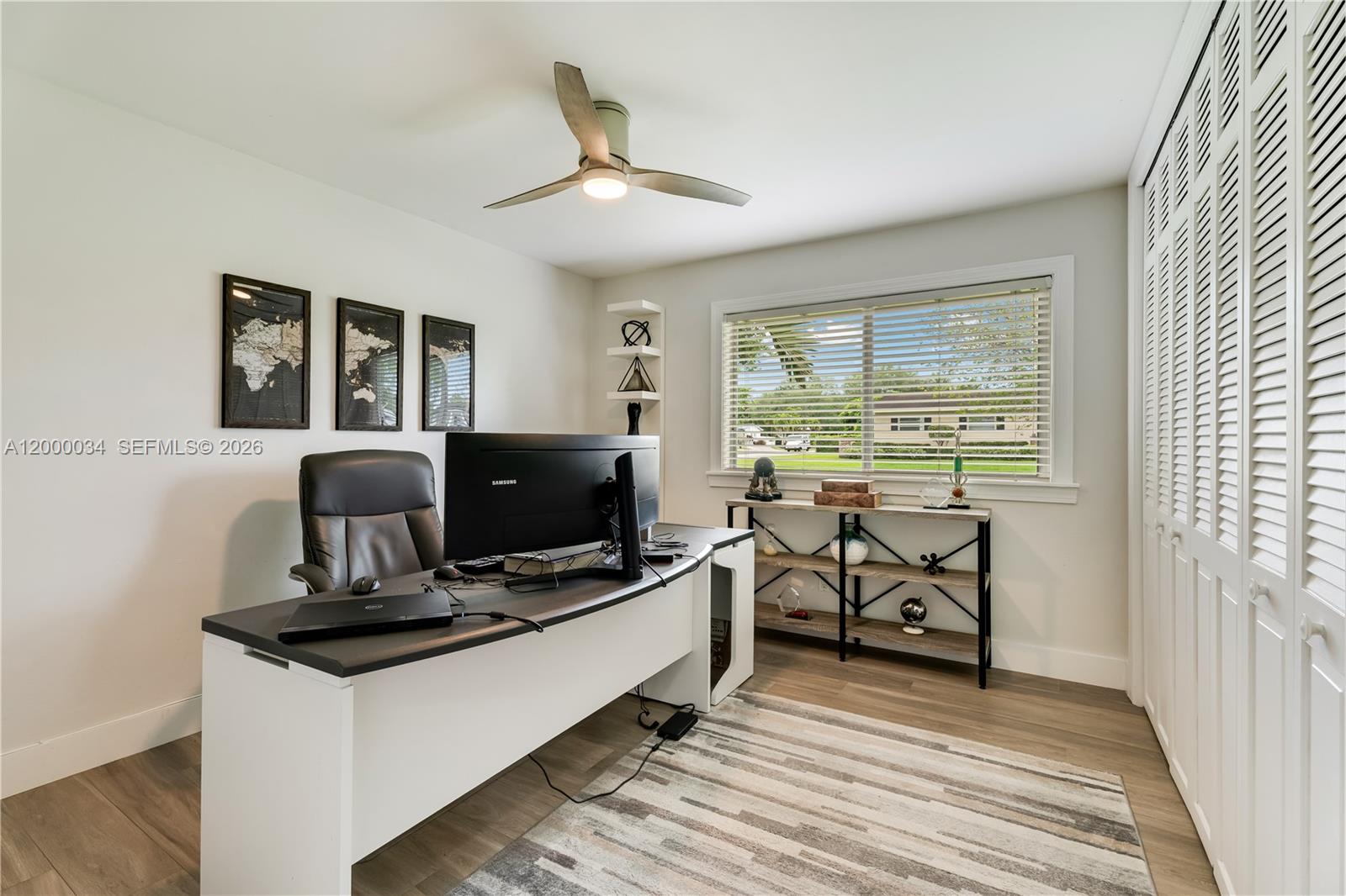 9511 Southwest 93rd Street Miami, FL 33176 - Photo 36 of 56 a view of a workspace with furniture and a window