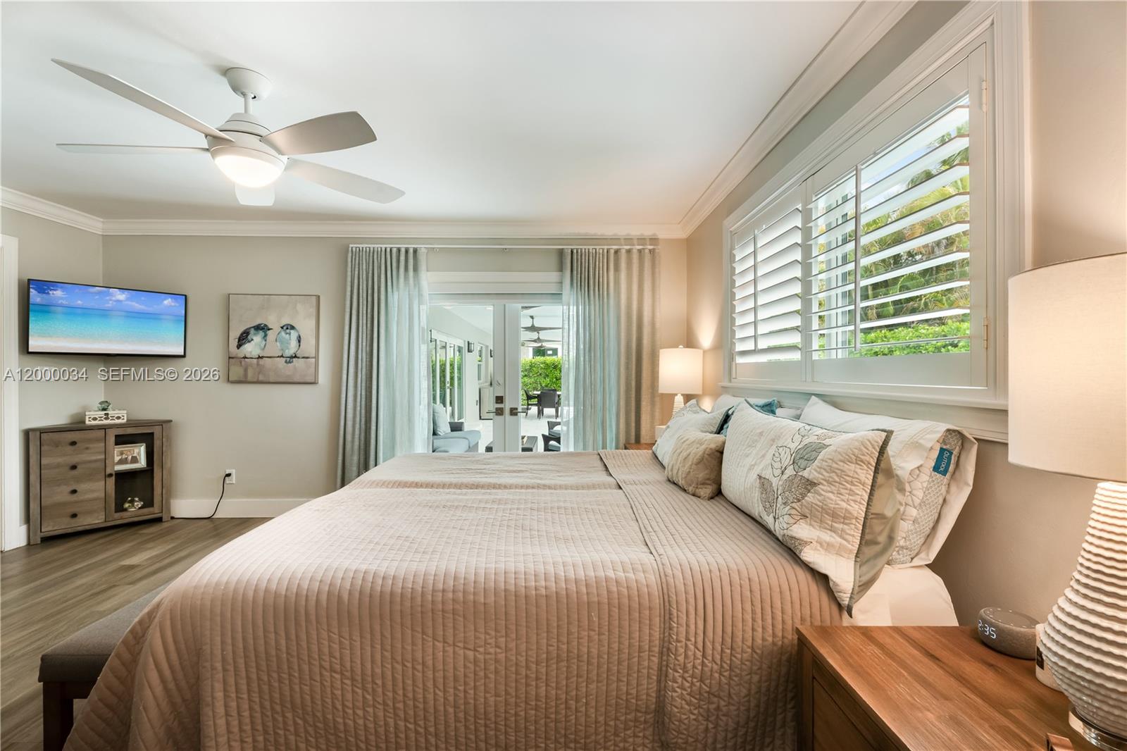 9511 Southwest 93rd Street Miami, FL 33176 - Photo 44 of 56 a bedroom with a large bed and a window
