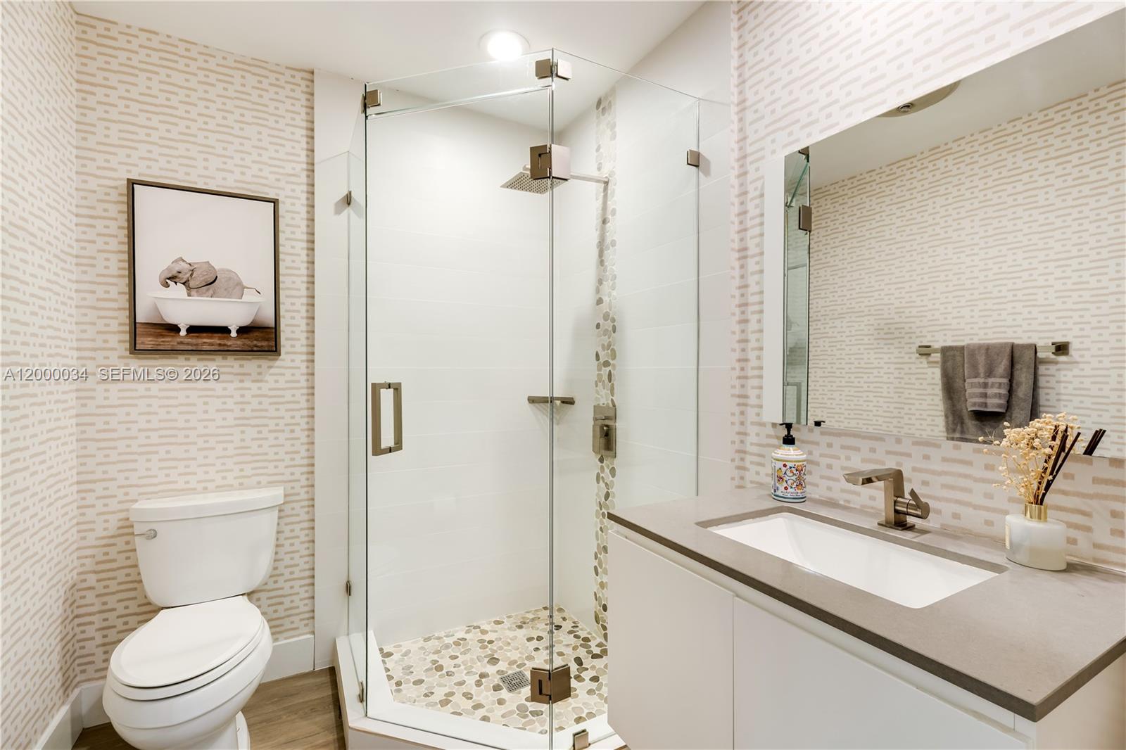 9511 Southwest 93rd Street Miami, FL 33176 - Photo 47 of 56 a bathroom with a granite countertop sink toilet and shower