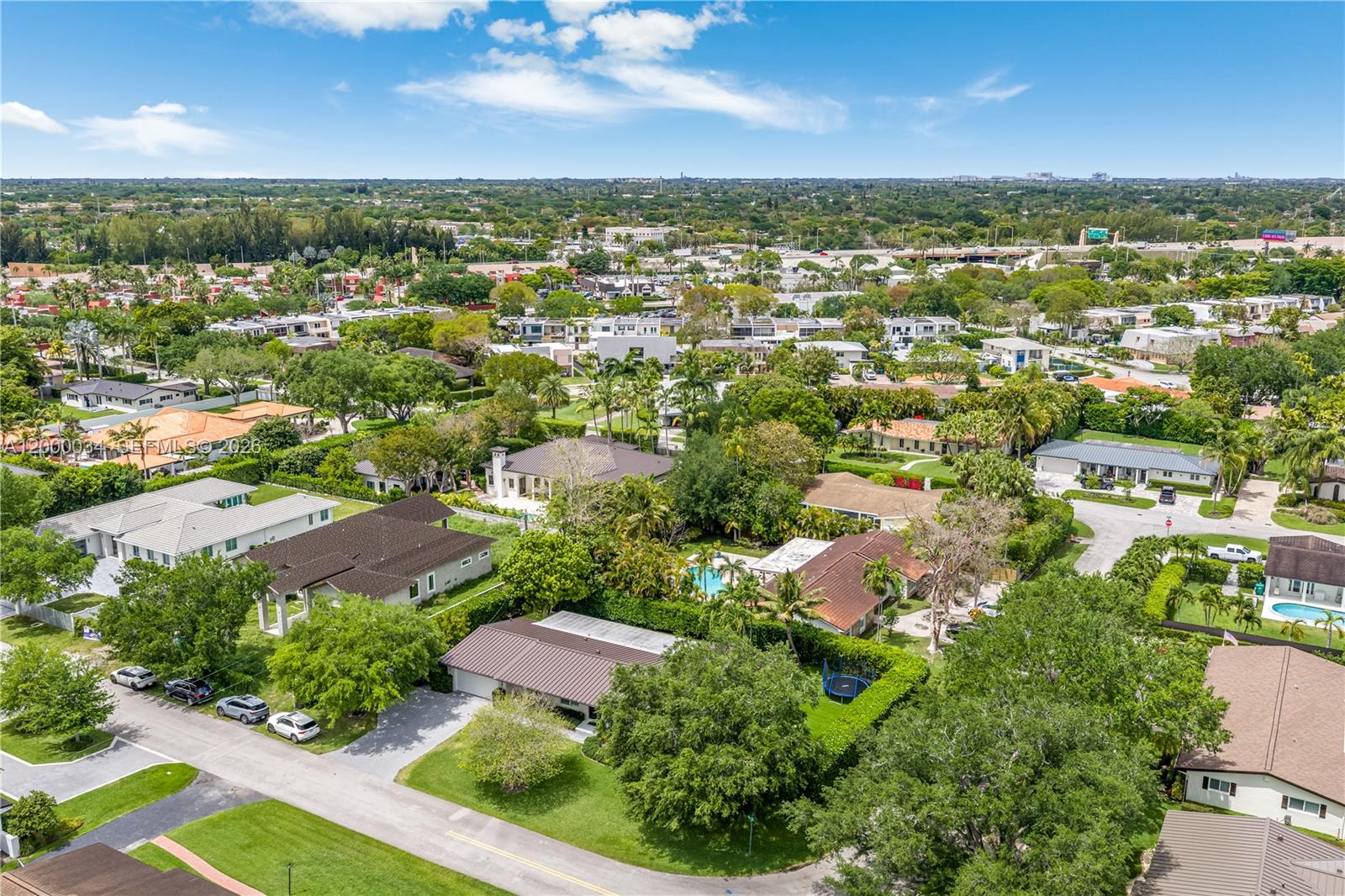 9511 Southwest 93rd Street Miami, FL 33176 - Photo 48 of 56 an aerial view of residential houses with outdoor space and street view