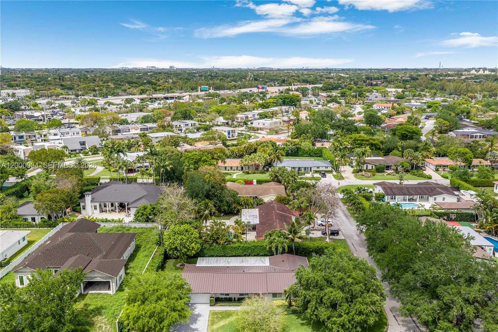 9511 Southwest 93rd Street Miami, FL 33176 - Photo 52 of 56 an aerial view of residential houses with outdoor space and ocean view