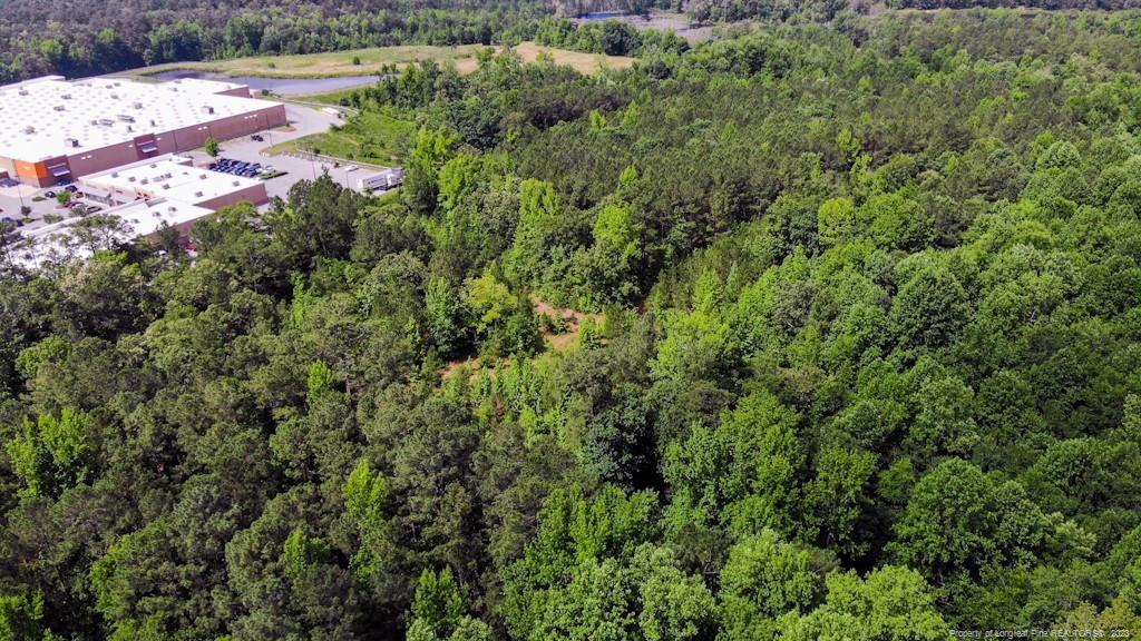 24-87 Nc Cameron, NC 28326 - Photo 12 of 28 an aerial view of a houses with yard