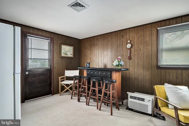 a view of a livingroom with furniture and windows