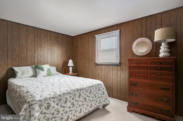 a bedroom with a bed and a closet