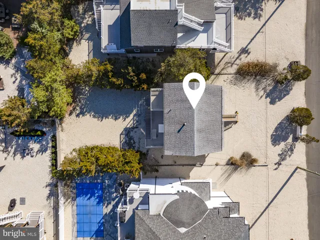 a view of a house with yard and sitting area