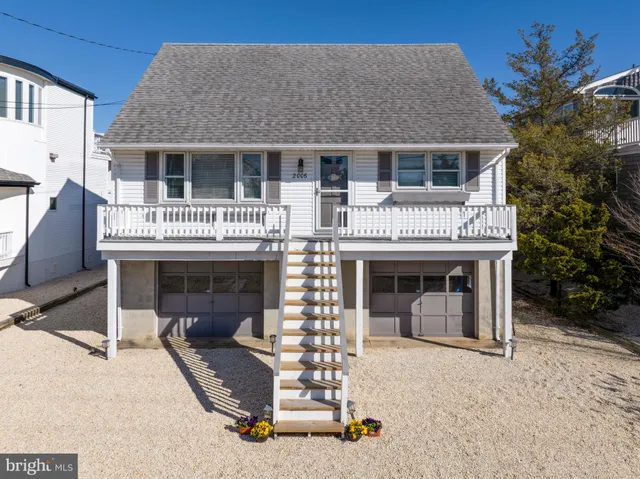 a front view of a house with a garage