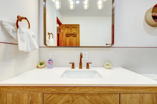 a bathroom with a sink and a window