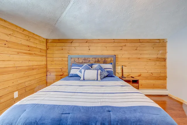 a view of entry way with wooden wall