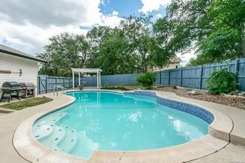 a view of a swimming pool with a patio