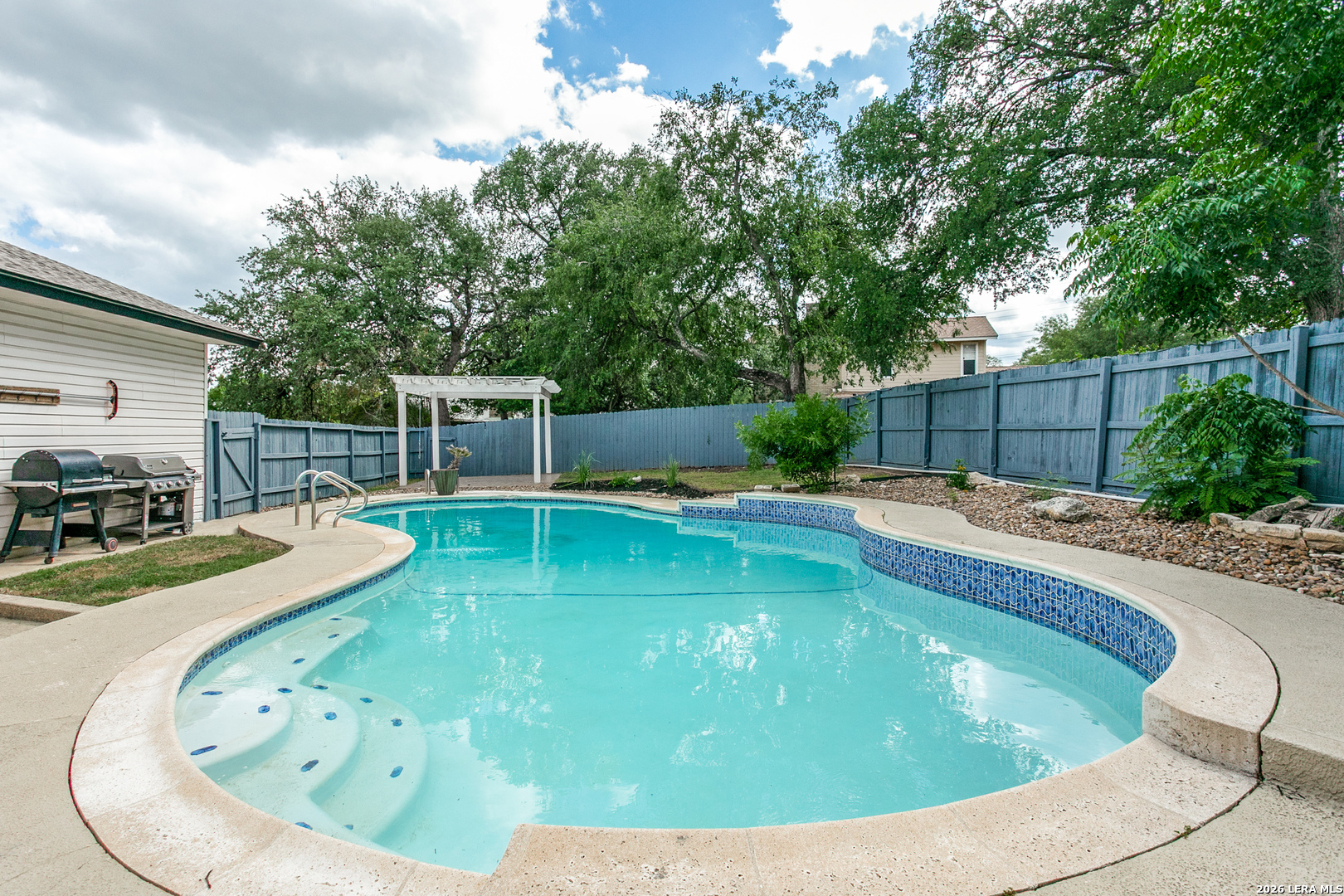 102 Silver Spring Universal City, TX 78148 - Photo 33 of 36 a view of a swimming pool with a patio