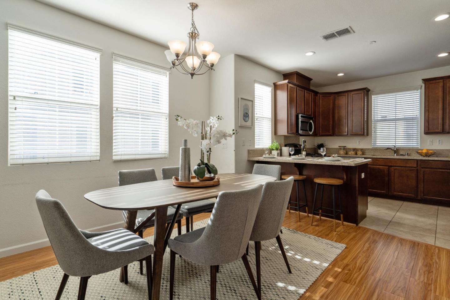650 Macabee Way Hayward, CA 94541 - Photo 17 of 73 a view of a dining room with furniture window and wooden floor