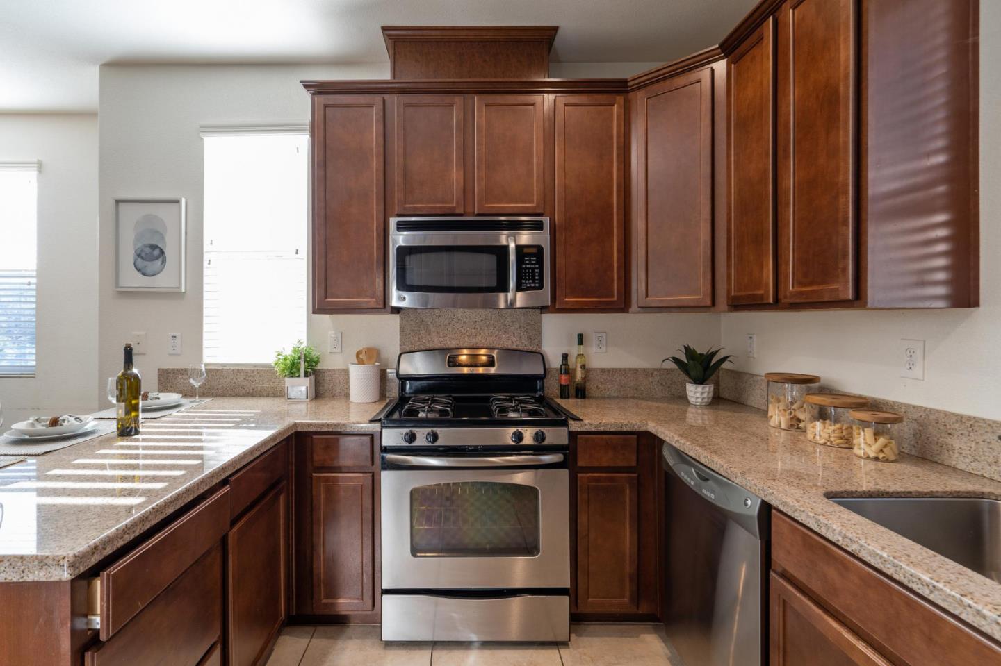 650 Macabee Way Hayward, CA 94541 - Photo 28 of 73 a kitchen with a sink stove and microwave
