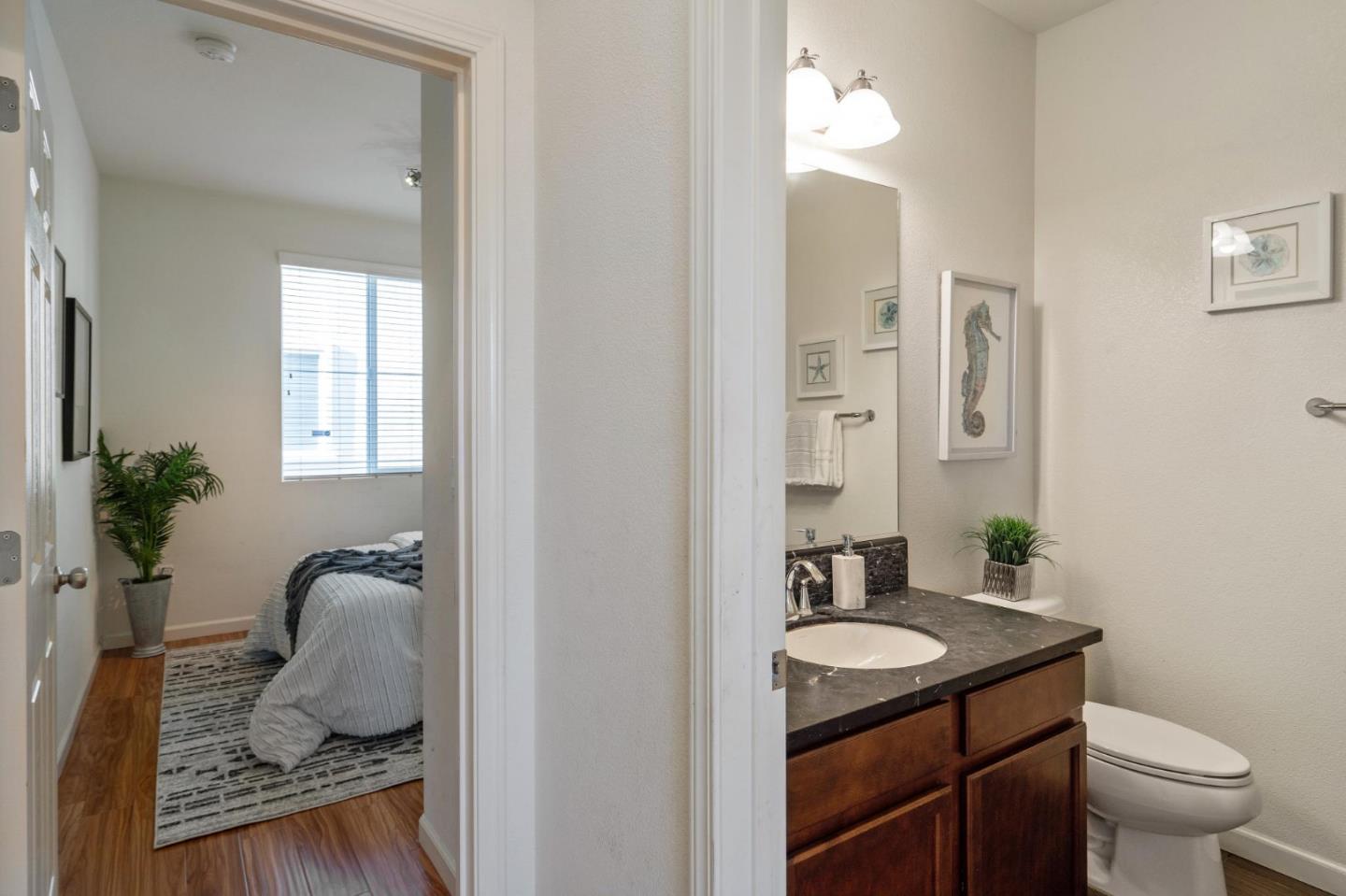 650 Macabee Way Hayward, CA 94541 - Photo 31 of 73 a bathroom with a granite countertop sink and a mirror
