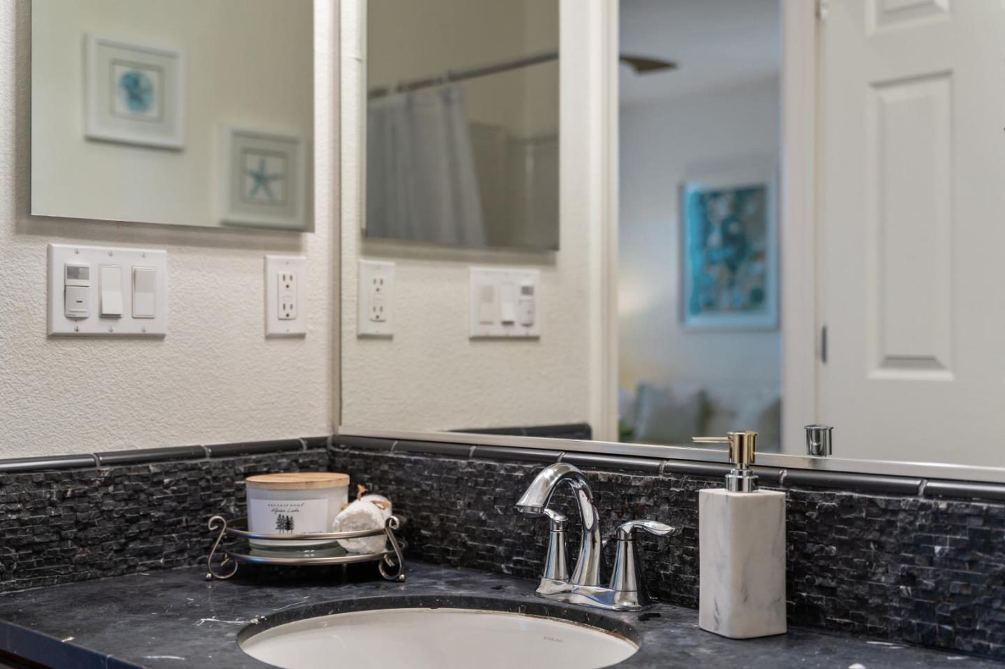 650 Macabee Way Hayward, CA 94541 - Photo 33 of 73 a bathroom with a sink and a mirror
