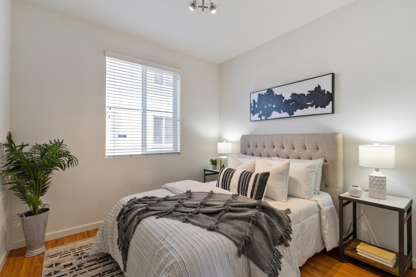 650 Macabee Way Hayward, CA 94541 - Photo 34 of 73 a bedroom with bed and a potted plant