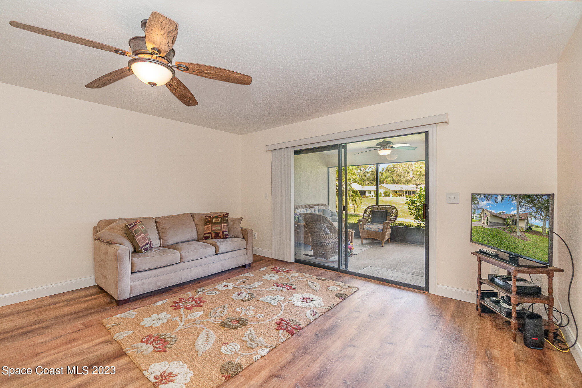 1670 Old Glory Boulevard Melbourne, FL 32940 - Photo 6 of 51 a living room with furniture and a large window