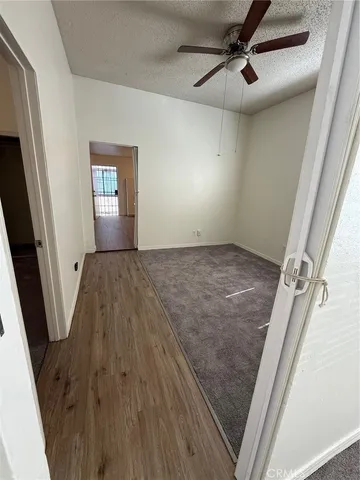 a view of a hallway view with wooden floor and staircase