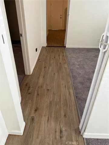 a room with a bench and cabinets