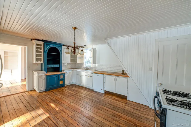 a view of balcony with wooden floor