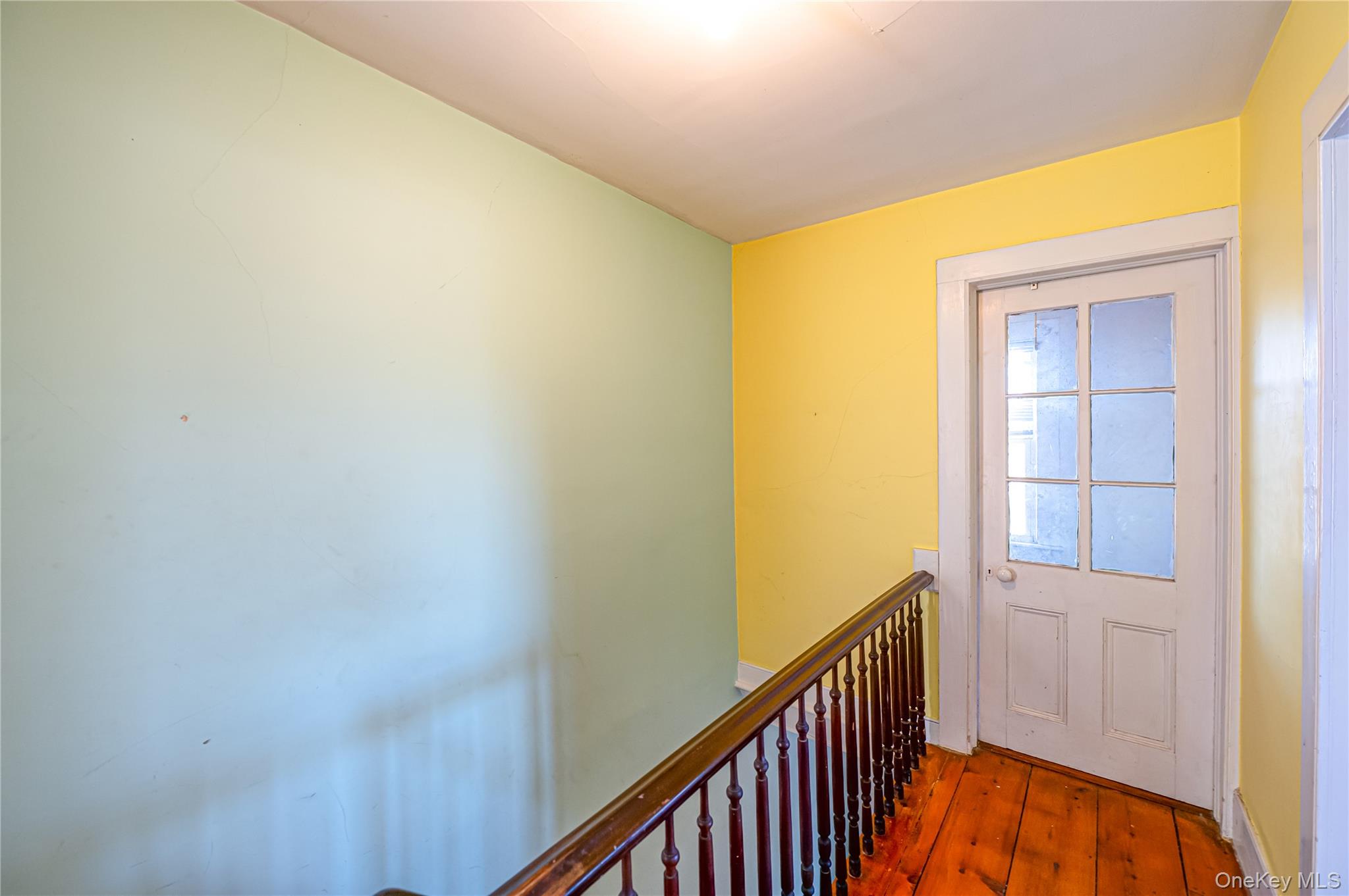 179 G Springville Road Hampton Bays, NY 11946 - Photo 22 of 45 Doorway with hardwood / wood-style floors and baseboards