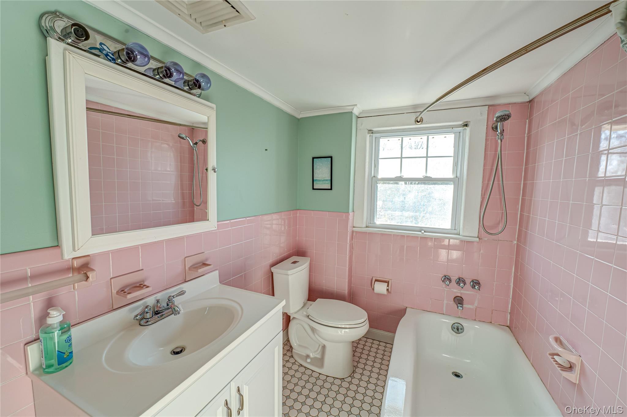 179 G Springville Road Hampton Bays, NY 11946 - Photo 25 of 45 Full bath with vanity, bathtub / shower combination, tile walls, wainscoting, and ornamental molding