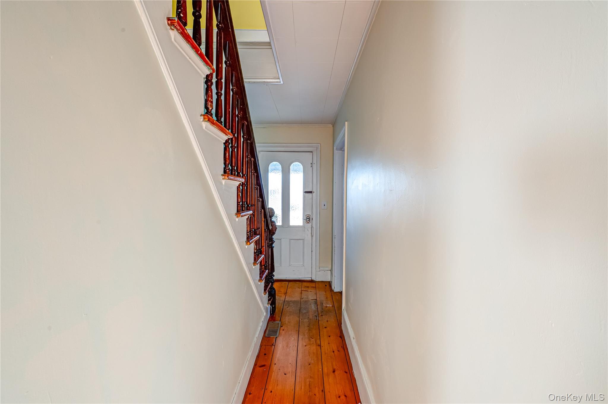 179 G Springville Road Hampton Bays, NY 11946 - Photo 26 of 45 Doorway to outside featuring ornamental molding, stairway, and hardwood / wood-style flooring