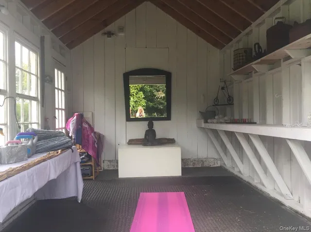 a room with furniture and large windows