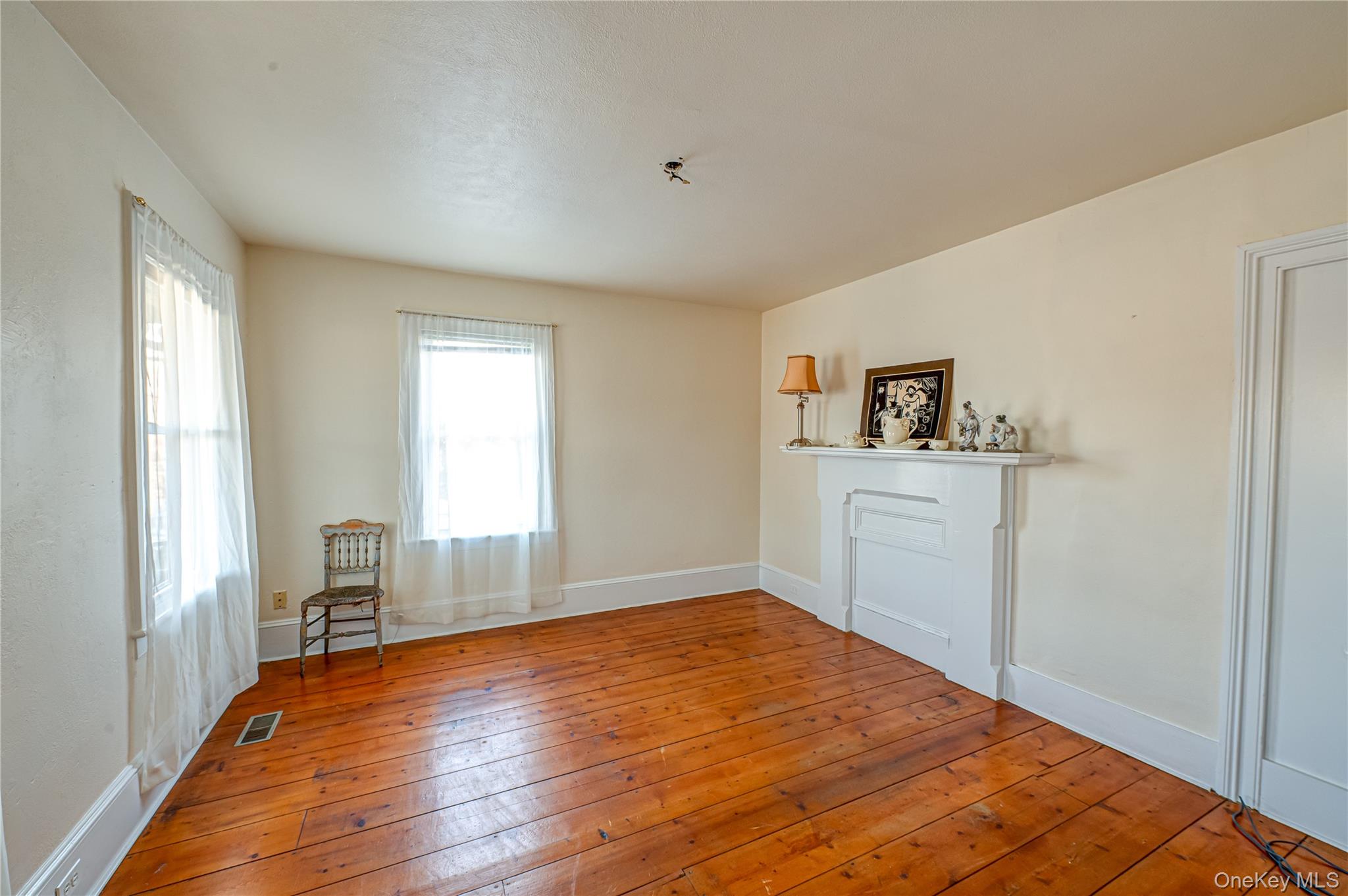 179 G Springville Road Hampton Bays, NY 11946 - Photo 35 of 45 Sitting room featuring wood-type flooring