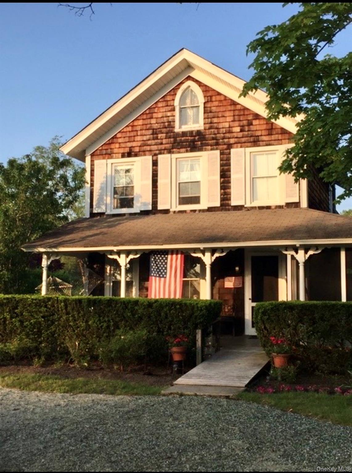 179 G Springville Road Hampton Bays, NY 11946 - Photo 41 of 45 View of front of house featuring a porch