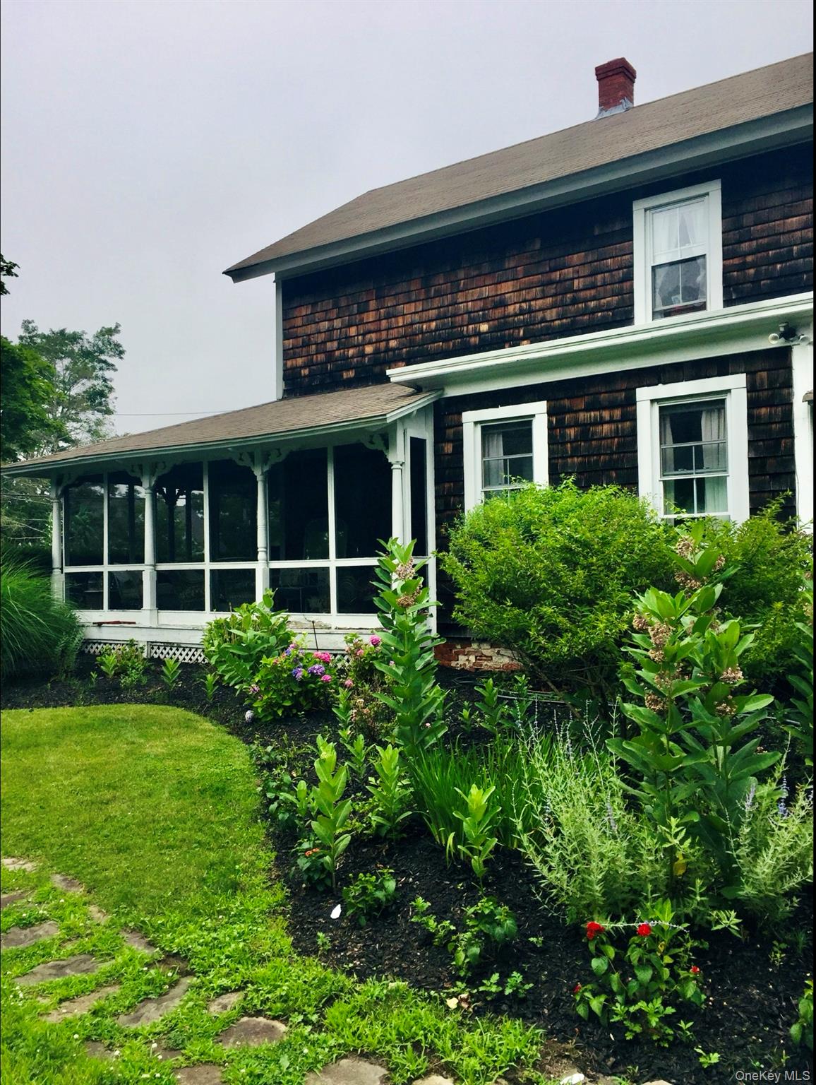 179 G Springville Road Hampton Bays, NY 11946 - Photo 43 of 45 Back of property with a sunroom and a chimney