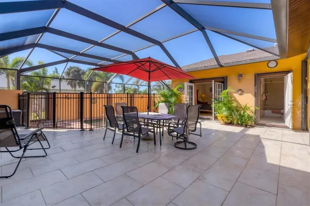 a view of a dining table and chairs in the patio