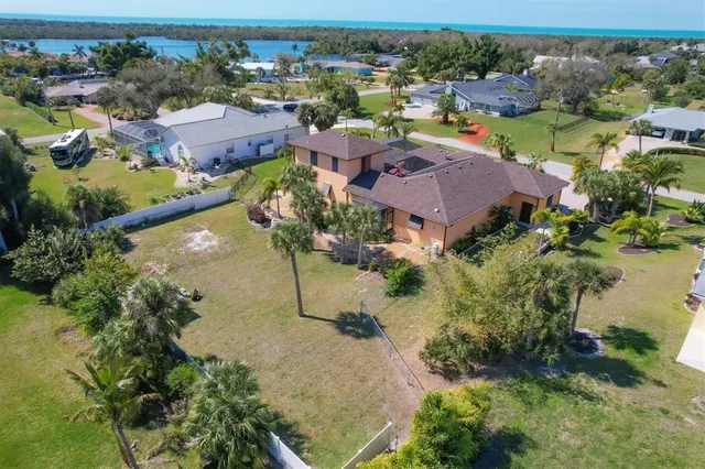 an aerial view of residential houses with outdoor space