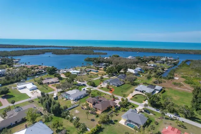 an aerial view of residential building and lake