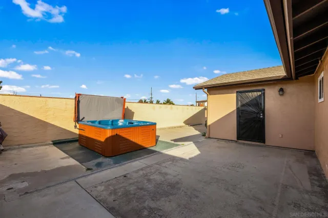 a view of a swimming pool with an outdoor seating