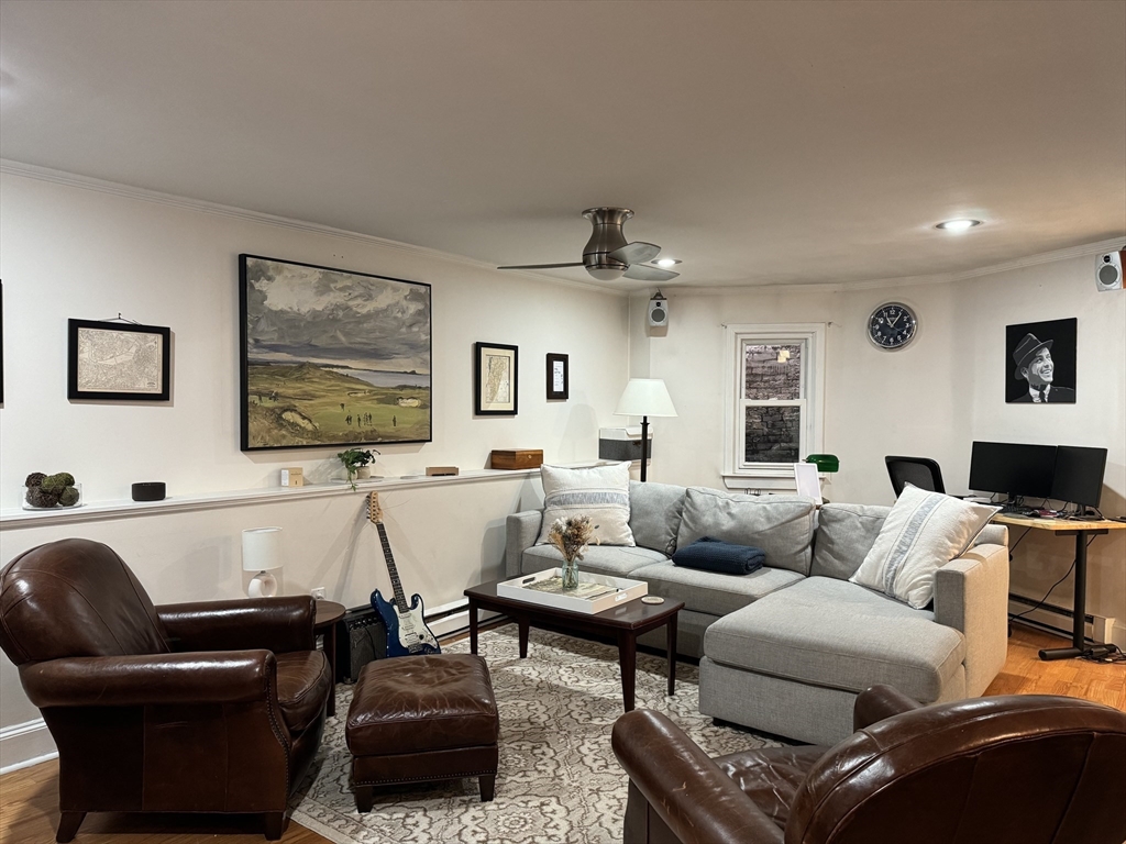 519 Columbus Avenue, Unit 1 Boston, MA 02118 - Photo 5 of 10 a living room with furniture and a flat screen tv