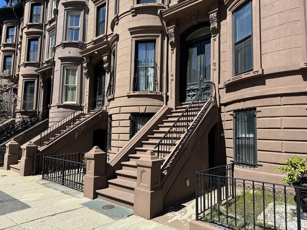 519 Columbus Avenue, Unit 1 Boston, MA 02118 - Photo 10 of 10 a view of a building with many windows