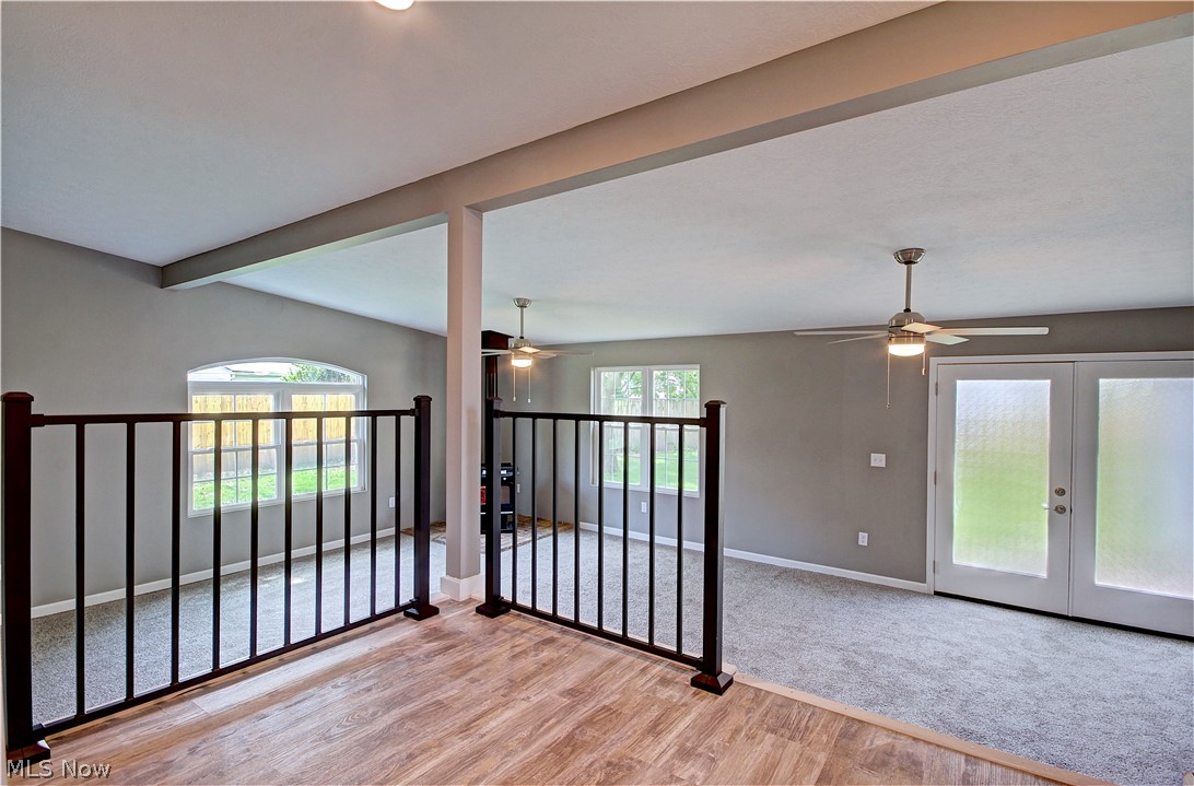 14507 Glencliffe Road Cleveland, OH 44111 - Photo 14 of 31 Spare room with light hardwood / wood-style floors, plenty of natural light, and ceiling fan