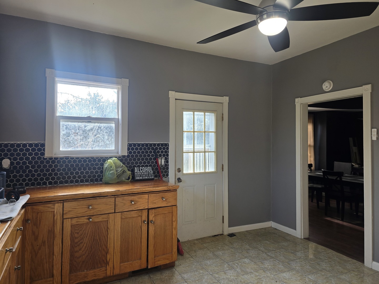 212 North Hunt Street Melvin, IL 60952 - Photo 15 of 43 a kitchen with stainless steel appliances kitchen island granite countertop cabinets and window