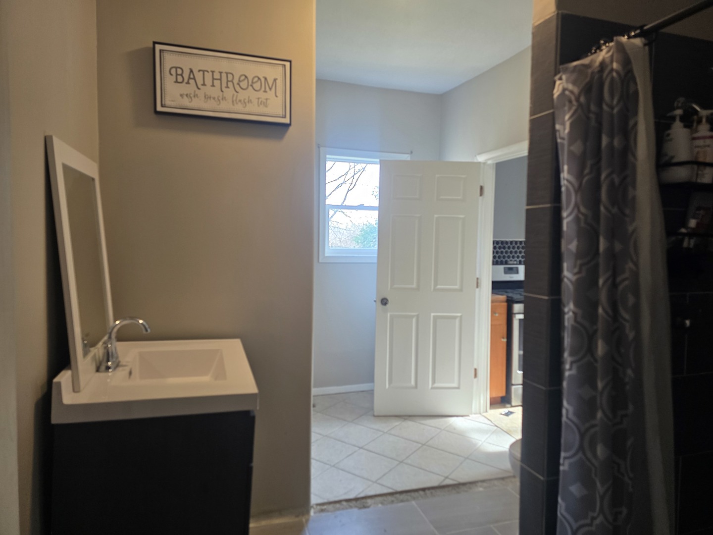 212 North Hunt Street Melvin, IL 60952 - Photo 16 of 43 a bathroom with a sink and a mirror