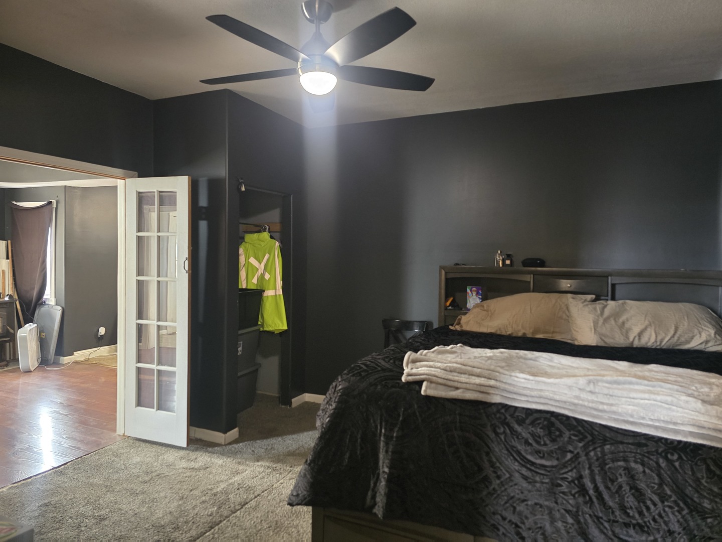 212 North Hunt Street Melvin, IL 60952 - Photo 19 of 43 a bedroom with a bed and a chandelier