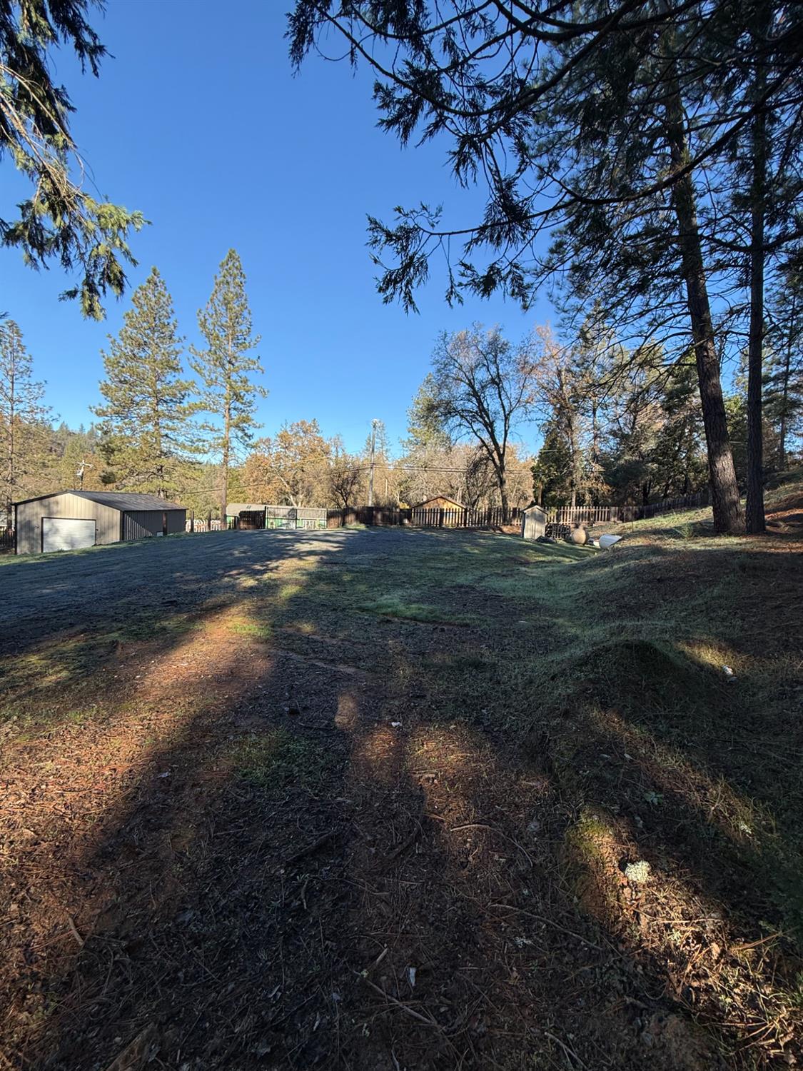 4876 Black Oak Mine Road Garden Valley, CA 95633 - Photo 21 of 31 a view of a yard next to a yard